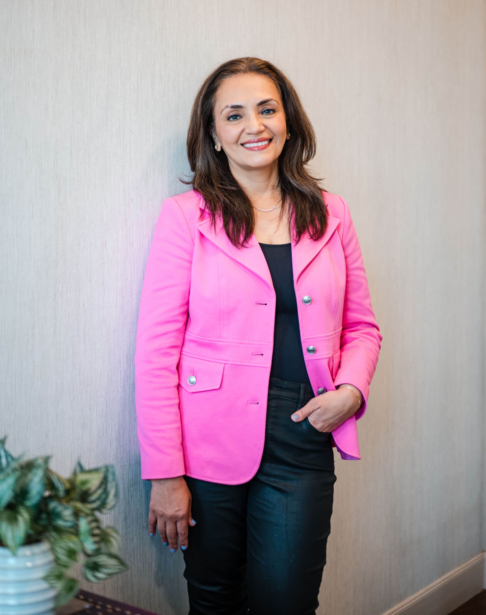 Dr. Meghna Dassani wearing a bright pink blazer