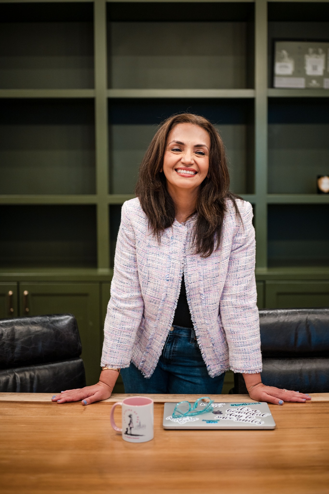 Dr. Meghna Dassani in conversation at a conference table