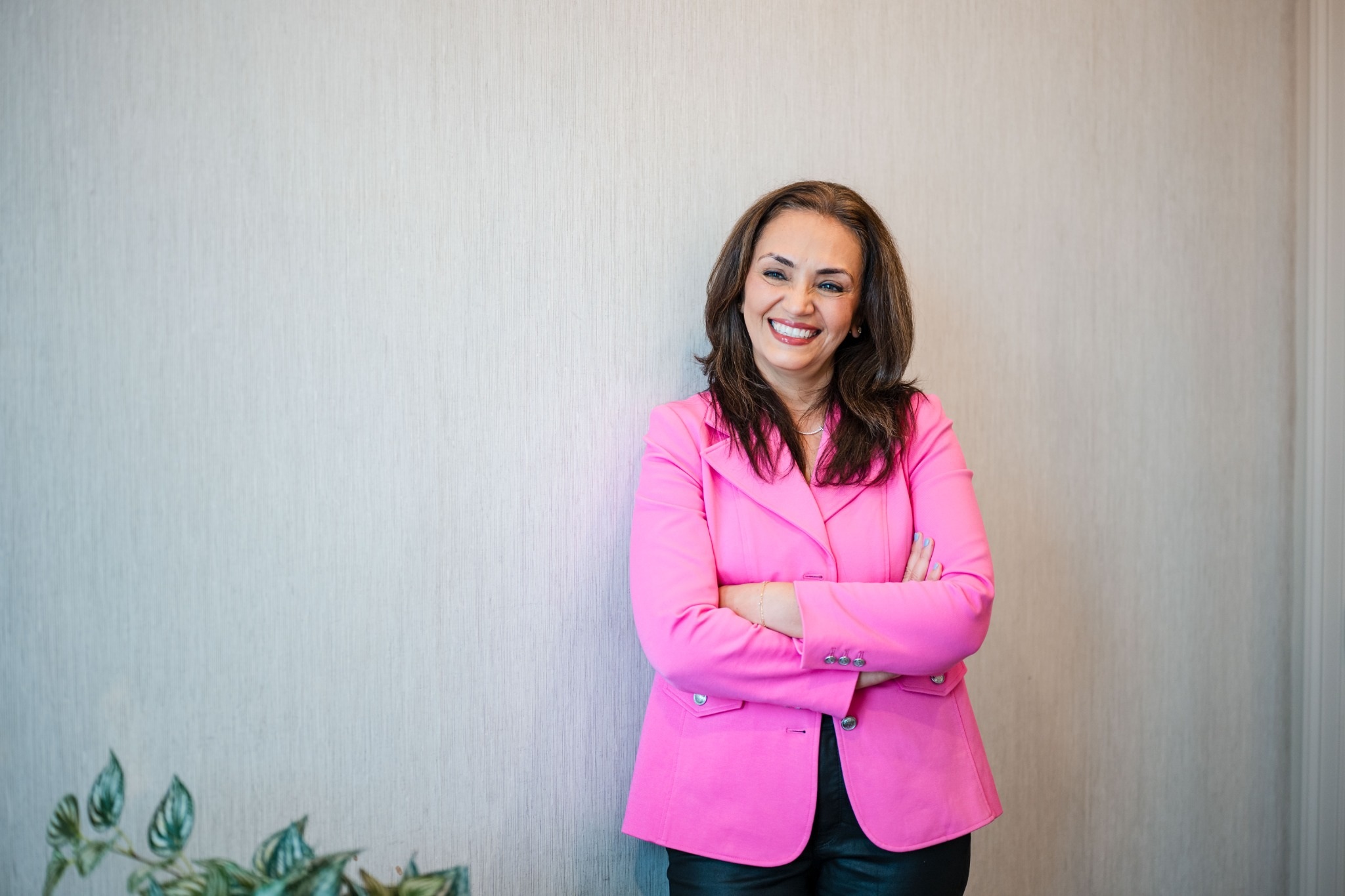 Dr. Meghna Dassani smiling in a pink blazer