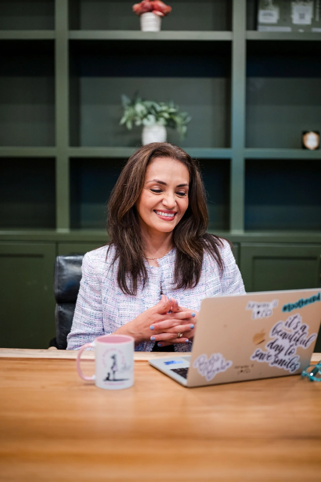 Dr. Dassani reviewing work on her macbook
